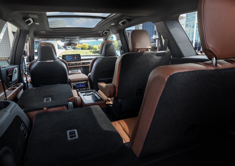 The interior of the 2025 Lincoln Aviator® SUV is shown with two seats folded down for added space. | Cummins Lincoln in Weatherford OK