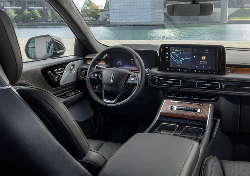 The interior of the 2025 Lincoln Aviator® SUV is shown parked with a view of a harbor through the windshield. | Cummins Lincoln in Weatherford OK