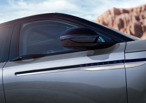 Blue lettering on the side of the vehicle that reads nautilus indicates the available hybrid powertrain. | Cummins Lincoln in Weatherford OK