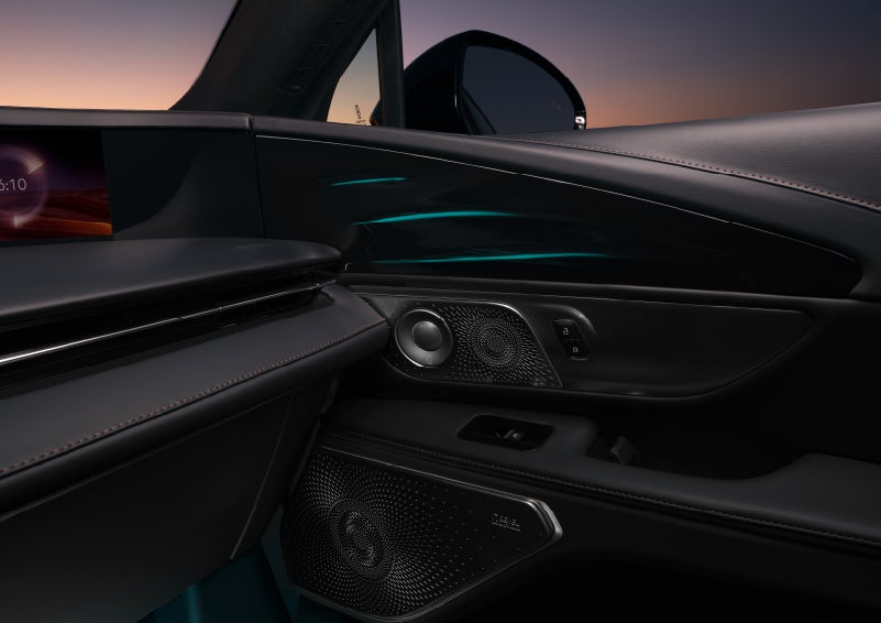 Selectable ambient lighting glows in the passenger door panel. | Cummins Lincoln in Weatherford OK