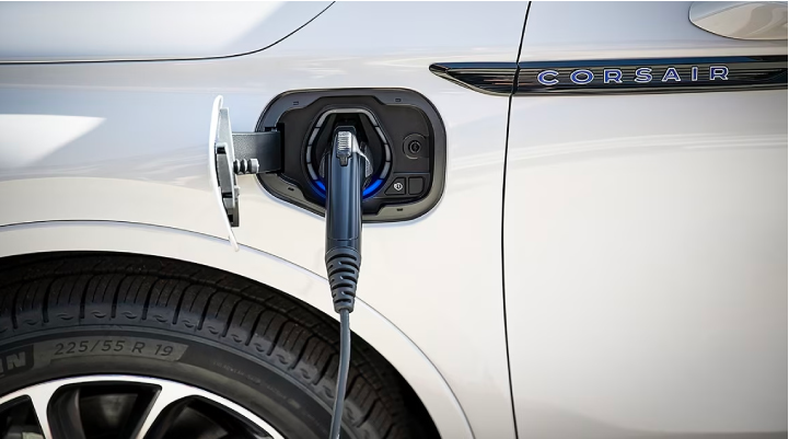 An electric charger is shown plugged into the charging port of a Lincoln Corsair® Grand Touring
model. | Cummins Lincoln in Weatherford OK