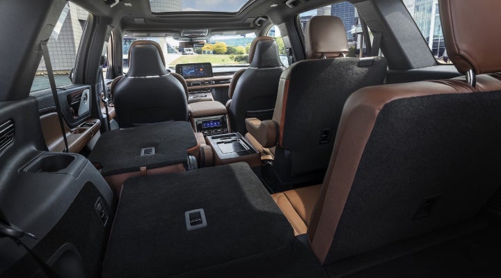 One side of the PowerFold® third-row seat and a second-row seat are folded forward in the 2026 Lincoln Aviator® SUV. | Cummins Lincoln in Weatherford OK