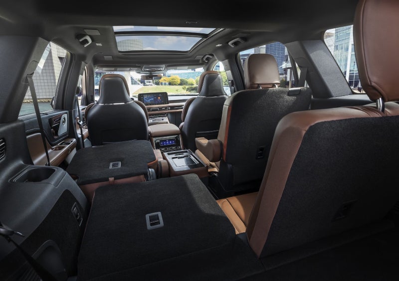 One side of the PowerFold® third-row seat and a second-row seat are folded forward in the 2026 Lincoln Aviator® SUV. | Cummins Lincoln in Weatherford OK