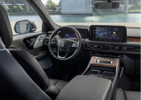 The interior of the 2026 Lincoln Aviator® SUV is shown parked with a view of a harbor through the windshield. | Cummins Lincoln in Weatherford OK