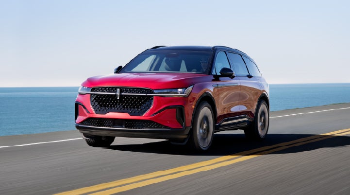 A 2026 Lincoln Nautilus® SUV is being driven on a seaside roadway. | Cummins Lincoln in Weatherford OK