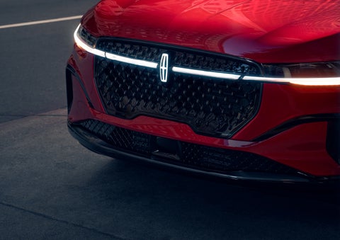 The available front LED light bar and center Lincoln Star logo glow at dusk. | Cummins Lincoln in Weatherford OK