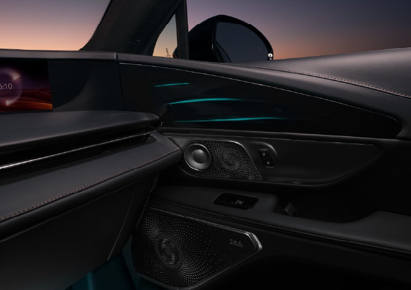 Selectable ambient lighting glows in the passenger door panel. | Cummins Lincoln in Weatherford OK