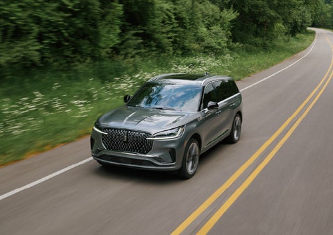 A 2027 Lincoln Aviator® SUV is being driven down a road. | Cummins Lincoln in Weatherford OK