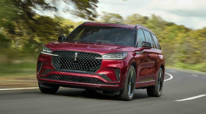 A 2027 Lincoln Aviator® SUV is being driven on a country road | Cummins Lincoln in Weatherford OK