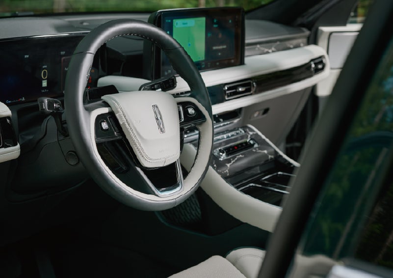 The leather-trimmed steering wheel of a 2027 Lincoln Aviator® Black Label™ SUV. | Cummins Lincoln in Weatherford OK