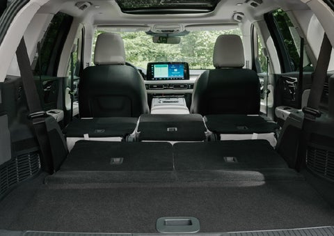 A rear to front view of the interior of a 2027 Lincoln Aviator® Black Label™ SUV shows the third and second rows folded flat | Cummins Lincoln in Weatherford OK